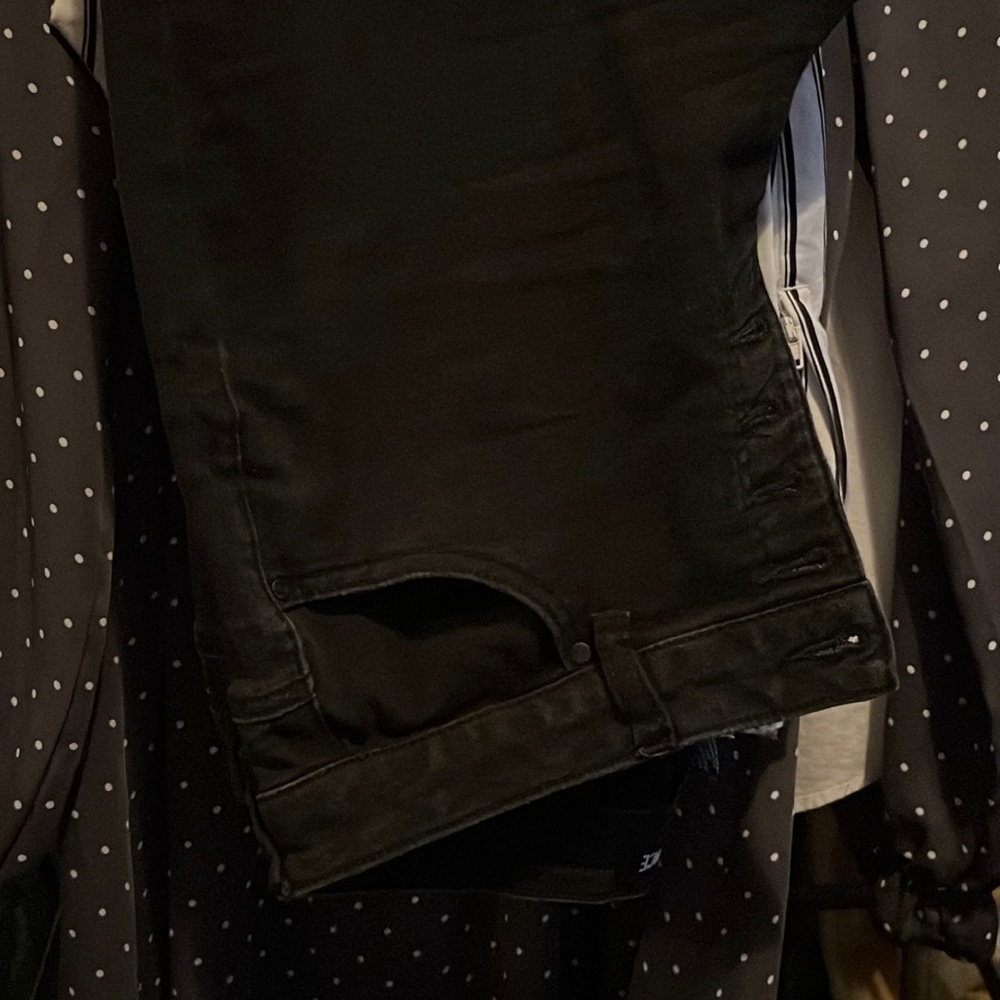 Woman’s black button up jeans